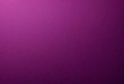 The primary subject of the image is a purple wall. The setting is a room with a purple wall, and the visual style is a close-up of the wall. The colors and mood of the image are predominantly purple, creating a calm and serene atmosphere.