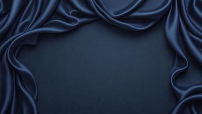The primary subject of the image is a blue cloth, which is the main object, scene, or focus of the image. The setting or background consists of a dark blue surface, which creates a moody atmosphere. The visual style of the image is a photo, showcasing the cloth's texture and details. The colors and mood of the image are predominantly dark blue, giving it a calm and serene appearance.