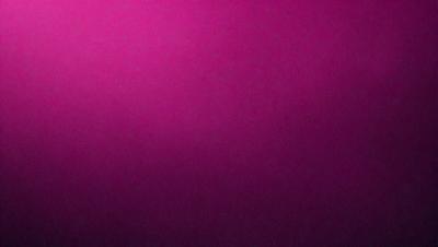 The primary subject of the image is a large, pink wall. The setting is a room with a pink background, and the visual style is a close-up of the wall. The dominant colors in the image are pink, and the overall atmosphere is warm and inviting.