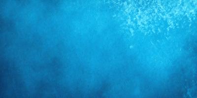 The primary subject of the image is a blue background with a few white clouds. The setting is a clear blue sky, and the visual style is a digital art or illustration. The colors and mood of the image are predominantly blue and calm, creating a serene atmosphere.