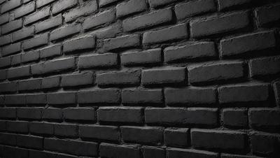 The primary subject of the image is a brick wall. The setting is a dark room, and the visual style is a black and white photo. The dominant colors are black and white, creating a moody atmosphere.
