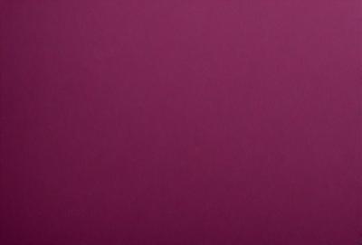 The primary subject of the image is a large, purple wall. The setting is a room with a pink background, which creates a warm and inviting atmosphere. The visual style is a close-up of the wall, showcasing its texture and color. The dominant colors are purple and pink, giving the scene a vibrant and lively mood.