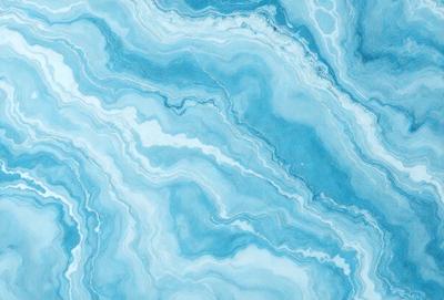 The primary subject of the image is a blue and white marbled tile. The setting is a bathroom, as indicated by the presence of the marbled tile. The visual style is a close-up of the tile, showcasing its intricate design. The dominant colors are blue and white, creating a calm and soothing atmosphere.