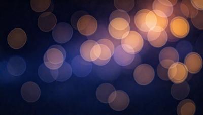 The primary subject of the image is a brightly lit, colorful background featuring a pattern of circles. The setting appears to be a dark room, with the circles creating a visually striking and vibrant atmosphere. The visual style of the image is a combination of a photo and digital art, as it captures the essence of a colorful, light-filled environment. The colors and mood of the image are predominantly bright and lively, with the circles adding a sense of depth and complexity to the overall composition.