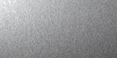 The primary subject of the image is a large, textured surface with a patterned texture. The setting is a gray background, which contrasts with the textured surface. The visual style is a close-up of the textured surface, showcasing its intricate pattern. The colors and mood of the image are predominantly gray, giving it a calm and serene atmosphere.