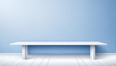The primary subject of the image is a white bench with a blue wall behind it. The bench is positioned in the center of the scene, and the blue wall serves as the setting or background. The visual style of the image is a photo, and the dominant colors are white and blue, creating a calm and serene atmosphere.