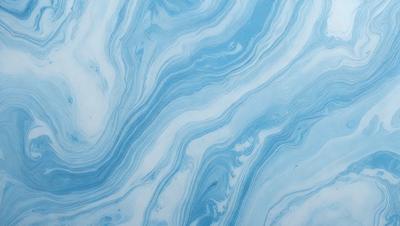The primary subject of the image is a blue and white swirling pattern, which appears to be a part of a larger blue and white design. The setting is a blue and white surface, possibly a wall or a piece of artwork. The visual style of the image is a close-up of the swirling pattern, showcasing its intricate details. The colors and mood of the image are predominantly blue and white, creating a sense of calmness and elegance.