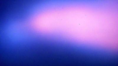 The primary subject of the image is a pink and blue sky. The sky is filled with clouds, creating a beautiful and colorful backdrop. The visual style of the image is a photo, capturing the natural beauty of the sky. The colors and mood of the image are vibrant and lively, with the pink and blue hues creating a sense of warmth and tranquility.