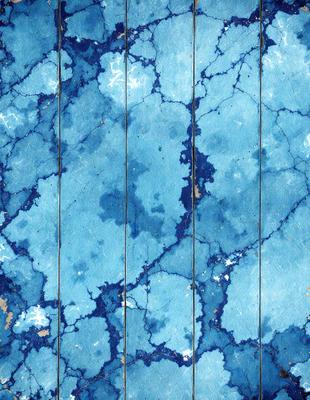 The primary subject of the image is a blue and white marbled surface, which appears to be a piece of wood. The setting is a close-up of the marbled surface, showcasing its unique texture and design. The visual style is a close-up of the marbled surface, which gives the image a detailed and artistic appearance. The colors and mood of the image are predominantly blue and white, creating a sense of calmness and elegance.