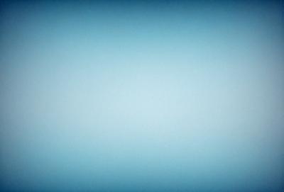 The primary subject of the image is a large, empty, and blue sky. The setting is a vast, open space with no visible landmarks or objects. The visual style is a natural, outdoor scene with a focus on the sky. The colors and mood are predominantly blue, creating a calm and serene atmosphere.