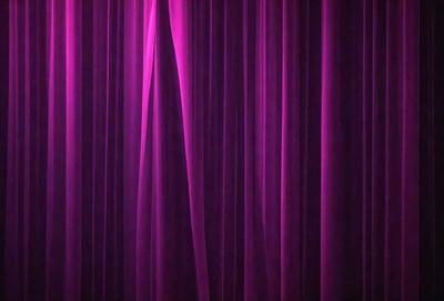 The primary subject of the image is a purple curtain, which is the main object, scene, or focus of the image. The setting/background consists of a purple curtain, which is the primary visual element in the image. The visual style is a photo, as the image is a close-up of the purple curtain. The colors and mood of the image are predominantly purple, creating a calm and serene atmosphere.