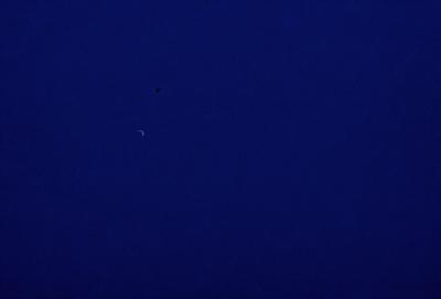 The primary subject of the image is the night sky, which is filled with stars. The setting is a dark, star-filled night, with no visible landmarks or objects. The visual style is a natural, nighttime scene, with no indication of digital manipulation or artistic elements. The colors and mood of the image are predominantly dark and serene, with the stars providing a sense of depth and tranquility.