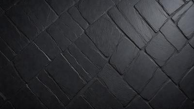 The primary subject of the image is a black tile floor. The setting is a dark room with a black tile floor, which creates a moody atmosphere. The visual style is a close-up of the black tile floor, showcasing its texture and pattern. The colors and mood of the image are predominantly dark, with the black tile floor being the main focus.