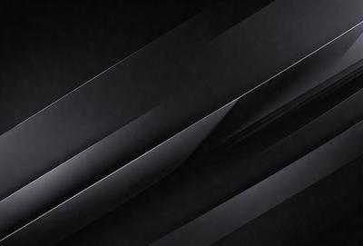 The primary subject of the image is a close-up of a silver metal surface. The setting is a dark background, which contrasts with the shiny metal. The visual style is a black and white photo, giving the image a classic and timeless appearance. The colors and mood are predominantly dark, with the silver metal being the main focal point.