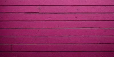 The primary subject of the image is a pink wall. The setting is a room with a pink wall, and the visual style is a photo. The dominant colors are pink, and the overall atmosphere is warm and inviting.