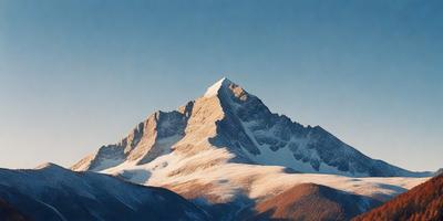 Primary subject: Snow-covered mountain peak
Setting/background: A clear blue sky with no clouds
Visual style: A photo of the mountain peak
Colors and mood: The image is in black and white, giving it a classic and timeless feel.