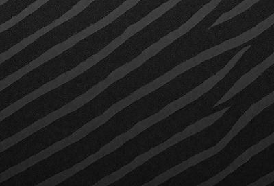The primary subject of the image is a black and white zebra pattern. The setting is a black background, and the visual style is a photo. The dominant colors are black and white, and the overall atmosphere is bold and striking.
