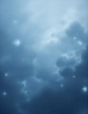 The primary subject of the image is a cloudy blue sky. The setting is a cloudy day, and the visual style is a photo. The sky is filled with clouds, and the dominant colors are blue and white. The overall atmosphere is calm and serene.