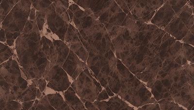 The primary subject of the image is a marble surface with a brown color. The setting is a room with a brown marble wall, and the visual style is a close-up of the marble surface. The colors and mood of the image are warm and natural, with the brown marble creating a sense of elegance and sophistication.