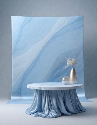 The primary subject of the image is a table with a vase of flowers on it. The table is placed in front of a blue wall, which serves as the setting and background of the scene. The visual style of the image is a photo, capturing the details of the table and the flowers. The colors and mood of the image are predominantly blue, creating a calm and serene atmosphere.