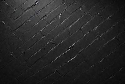 The primary subject of the image is a brick wall. The setting is a black background, which creates a dramatic contrast with the brick wall. The visual style is a close-up of the brick wall, showcasing its texture and details. The colors and mood of the image are predominantly dark, with the brick wall being the main focus.