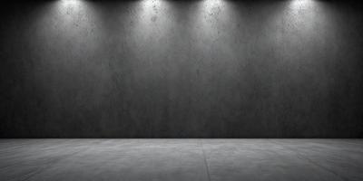 The primary subject of the image is a large, gray concrete wall. The setting is a room with a concrete floor, and the visual style is a photo. The dominant colors are gray and black, creating a stark and minimalist atmosphere.