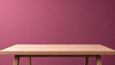 The primary subject of the image is a wooden table with a pink wall in the background. The table is positioned against the wall, and it appears to be a simple and functional piece of furniture. The visual style of the image is a photo, capturing the wooden table and the pink wall in a realistic manner. The colors and mood of the image are predominantly pink, creating a warm and inviting atmosphere.
