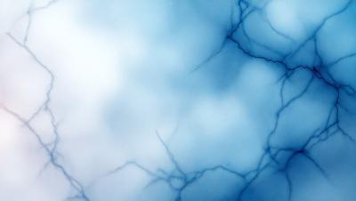 The primary subject of the image is a blue sky with clouds. The setting is a cloudy sky, and the visual style is a photo. The dominant colors are blue and white, creating a calm and serene atmosphere.