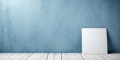 The primary subject of the image is a white box, which is placed on a wooden surface. The setting is a blue wall, which serves as the backdrop for the box. The visual style of the image is a photo, capturing the box and the wooden surface in detail. The colors and mood of the image are predominantly blue, creating a calm and serene atmosphere.