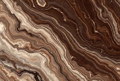 The primary subject of the image is a close-up of a marble stone with a unique and intricate pattern. The setting is a natural environment, with the stone being the main focus of the image. The visual style is a close-up of the marble, showcasing its texture and details. The colors and mood of the image are predominantly earthy tones, giving it a natural and timeless appearance.
