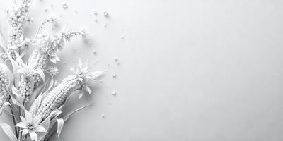The primary subject of the image is a white flower, which is the main focus of the scene. The flower is placed on a white background, creating a clean and minimalist visual style. The overall atmosphere of the image is serene and elegant, with the white flower being the center of attention.