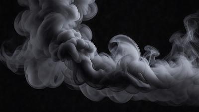 The primary subject of the image is a large, dark, and smoky cloud. The setting is a dark background, which contrasts with the cloud, creating a dramatic and moody atmosphere. The visual style is a black and white photo, which adds to the intensity of the scene. The colors and mood of the image are predominantly dark and mysterious, with the cloud serving as the focal point and the background providing a sense of depth and contrast.