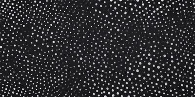 The primary subject of the image is a pattern of white dots on a black background. The setting is a dark background, which contrasts with the white dots. The visual style is a combination of a photo and digital art, as the dots are arranged in a way that resembles a digital artwork. The colors are predominantly black and white, creating a simple and minimalist mood.