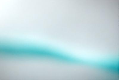 The primary subject of the image is a blue line or stripe, which is the main focus of the scene. The setting is a white background, which provides a clean and minimalist appearance. The visual style is a close-up of the blue line, emphasizing its texture and color. The colors and mood of the image are predominantly blue, creating a calm and serene atmosphere.