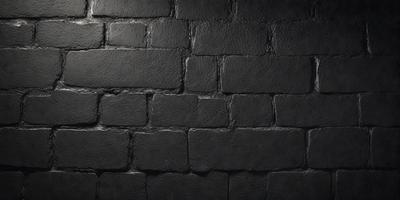 The primary subject of the image is a black brick wall. The setting is a dark room, and the visual style is a black and white photo. The dominant colors are black and white, creating a moody atmosphere.