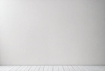 The image features a white wall with a wooden floor. The wall is clean and uncluttered, providing a blank canvas for any artwork or decoration. The wooden floor adds a warm and natural touch to the space. The overall atmosphere is minimalistic and serene, with a focus on the simplicity of the white wall and wooden floor.