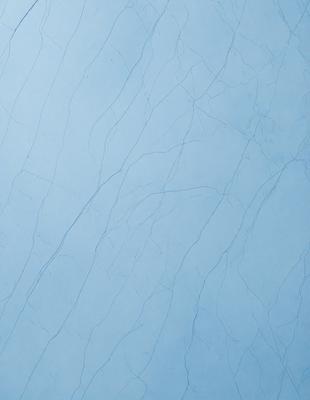 The primary subject of the image is a blue wall with a pattern of white streaks. The setting is a room with a blue background. The visual style is a close-up of the blue wall, showcasing the white streaks. The colors and mood of the image are predominantly blue and white, creating a calm and serene atmosphere.