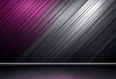 The primary subject of the image is a wall with a pink and silver striped pattern. The setting is a room with a black background. The visual style is a photo, and the colors and mood are predominantly pink and silver, creating a visually appealing and elegant atmosphere.