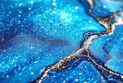 The primary subject of the image is a blue and gold swirling pattern, which appears to be a digital art or illustration. The setting is a blue background, and the visual style is a combination of digital art and illustration. The dominant colors are blue and gold, creating a vibrant and lively atmosphere.