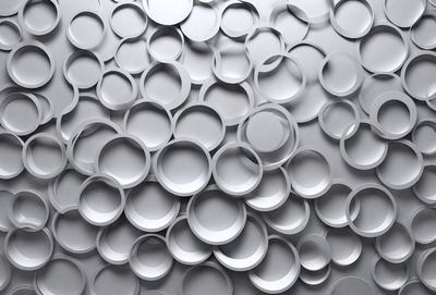 The primary subject of the image is a large number of white plastic cups arranged in a visually appealing manner. The cups are placed on a gray surface, which adds a contrasting element to the scene. The visual style of the image is a combination of photo and digital art, creating a unique and eye-catching pattern. The colors and mood of the image are predominantly white and gray, giving it a clean and minimalist appearance.