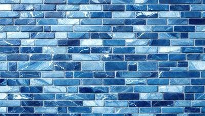 The primary subject of the image is a blue brick wall. The setting is a room with a blue brick wall as the main focus. The visual style is a photo of the blue brick wall. The dominant colors are blue and white, creating a calm and soothing atmosphere.