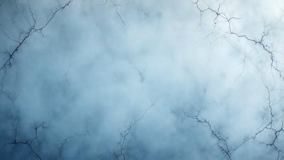 The primary subject of the image is a cloudy sky with a blue background. The setting is a cloudy day, and the visual style is a photo. The colors and mood of the image are predominantly blue, creating a calm and serene atmosphere.