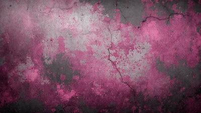 The primary subject of the image is a pink and grey wall with a cracked and peeling texture. The setting is a concrete wall, and the visual style is a close-up of the wall. The dominant colors are pink and grey, creating a mood of decay and impermanence.