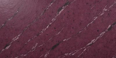 The primary subject of the image is a marbled surface, which appears to be a purple or red stone. The setting is a close-up of the marbled surface, showcasing its intricate patterns and textures. The visual style is a realistic representation of the marbled surface, capturing its natural beauty. The colors and mood of the image are predominantly purple or red, creating a warm and inviting atmosphere.