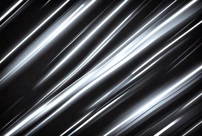 The primary subject of the image is a black and white photo of a light streak. The setting is a dark background, and the visual style is a close-up of the light streak. The colors and mood of the image are predominantly black and white, creating a dramatic and artistic atmosphere.