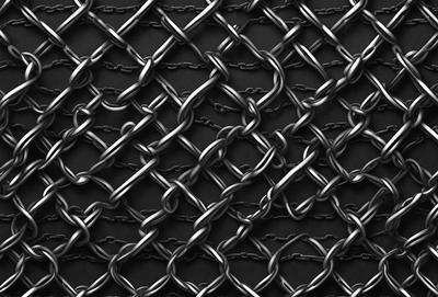 The primary subject of the image is a chain link fence. The setting is a black background, which creates a contrast with the chain link fence. The visual style is a close-up of the chain link fence, showcasing its texture and details. The colors and mood of the image are predominantly black and silver, giving it a sleek and modern appearance.