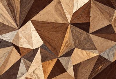 The primary subject of the image is a wooden floor with a geometric pattern. The setting is a room with a wooden floor, and the visual style is a close-up of the floor. The colors and mood of the image are warm and inviting, with the wooden floor being the main focus.