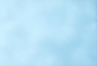 The primary subject of the image is a blue sky with clouds. The setting is a clear day with a cloudy sky, and the visual style is a natural, outdoor scene. The colors and mood of the image are predominantly blue, creating a calm and serene atmosphere.