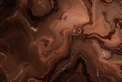 The primary subject of the image is a close-up of a marble surface with a pattern of swirls and curves. The setting is a dark room, and the visual style appears to be a photo of the marble surface. The colors and mood of the image are dark and moody, with the marble surface being the main focus.