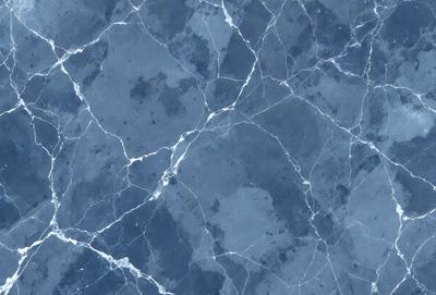 The primary subject of the image is a blue marble wall with a pattern of white and blue swirls. The setting is a room with a blue marble floor. The visual style is a close-up of the marble wall, showcasing the intricate pattern. The colors and mood of the image are predominantly blue, creating a calm and serene atmosphere.